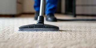 Technician deep cleaning carpet